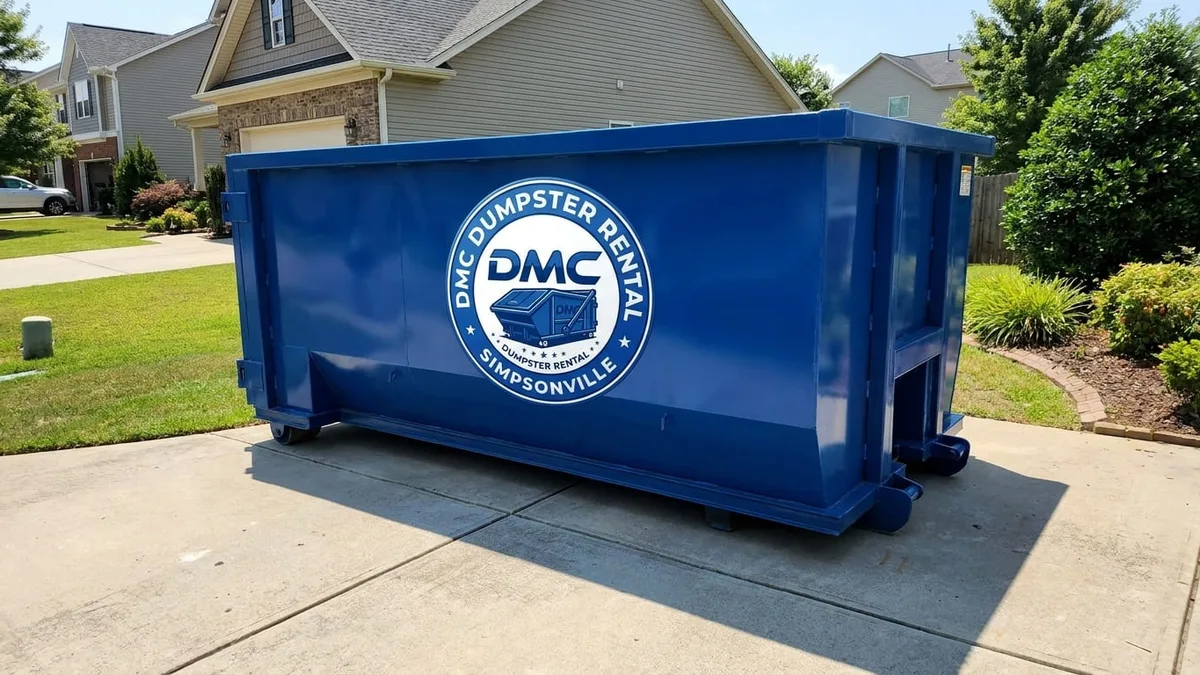 Dumpster rental in Simpsonville, SC DMC Dumpster Rental roll-off dumpster being delivered to a Simpsonville, South Carolina driveway